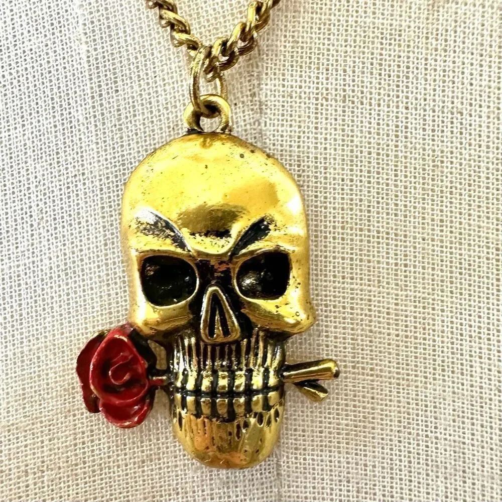 Gold tone skull with rose pendant necklace